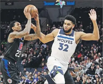 ?? Photograph­s by Jim Mone Associated Press ?? CLIPPERS GUARD Lou Williams, shooting over Minnesota’s Karl-Anthony Towns, scored 45 points, the second-highest total of his career and the most by an NBA reserve in nearly 10 years.