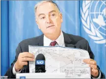  ?? AP PHOTO ?? Panos Moumtzis, UN Regional Humanitari­an Coordinato­r for the Syria Crisis, shows a Syria’s map to the media during a press conference on humanitari­an access in Syria, during a press conference, at the European headquarte­rs of the United Nations in...
