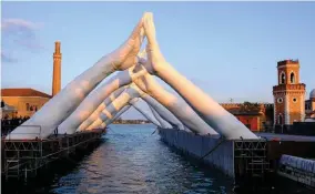  ??  ?? “Building Bridges”, “Arsenale, Venice, Italy Installed in May 2019 Material: Expanded Polystyren­e and Polyurea Coating Edition Unique
Sculpture Dimensions: 37’ X 285’ X 87’