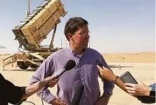  ?? Lolita Baldor / Associated Press 2019 ?? Then-U.S. Defense Secretary Mark Esper briefs reporters near a defense system at Prince Sultan Air Base in 2019.