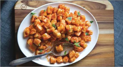  ?? TRIBUNE CONTENT AGENCY ?? While gnocchi pairs well with many sauces, the Batali family enjoys a fresh pomodoro.