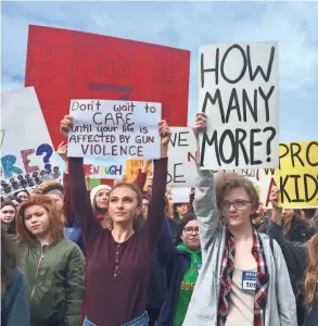  ??  ?? Students at Roosevelt High School take part in a protest against gun violence last week in Seattle. Politician­s in Washington state joined students who walked out of class to protest against gun violence.