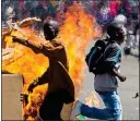  ??  ?? CIVIL STRIFE: Zimbabwe’s unrest is said to be on a par with risks here