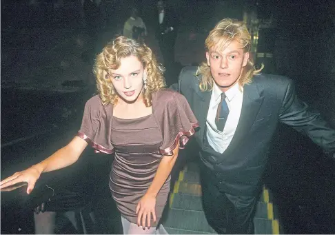  ??  ?? TALK OF THE TOWN: Kylie Minogue and Jason Donovan both denied in public that they were in a relationsh­ip.