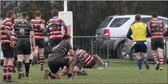  ??  ?? Killian Lett going over for one his two tries for Enniscorth­y during Saturday’s league-clinching victory.