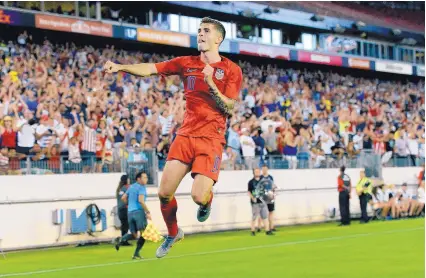  ?? MARK ZALESKI/ASSOCIATED PRESS ?? Christian Pulisic, shown celebratin­g after scoring a goal for the U.S. in the Gold Cup in July, is expected to make his Premier League debut Sunday with Chelsea.