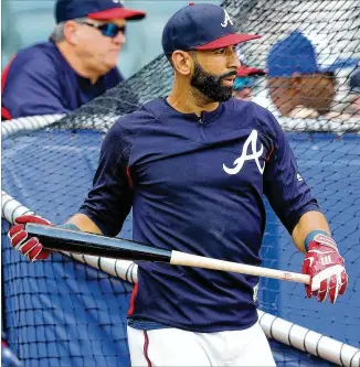  ?? CURTIS COMPTON / CCOMPTON@AJC.COM ?? Jose Bautista takes batting practice before his first game with the Braves on Friday. He has been installed at third base despite limited exposure there in recent years.