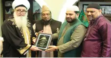  ??  ?? Haji Ashaf Khan 10 yrs service award Br Shazad Shah Appreciati­on award for leading Jumah salah After the distributi­on of Awards ceremony he thanked all attendees at this event. The program ended after Darrod o Salam, made Duaa Allama Shaykh NurJan for...