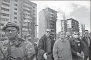  ?? Sergei Supinsky/afp via Getty Images/tns ?? U.N. Secretary-general Antonio Guterres, fourth from right, walks during his visit in Borodianka, outside Kyiv, Ukraine, on Thursday.