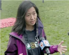  ?? Jim michAud phOTOs / BOsTON hErAld ?? HERE’S THE PLAN: Mayor candidate and Councilor Michelle Wu speaks to the media about her massive investment for Boston Public schools plan in front of Boston English High School on Sunday.