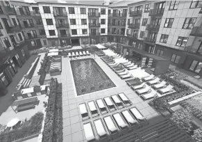  ?? ?? The Tempo apartments in Hilliard, expected to open in spring of 2026, will include a pool and courtyard featuring cabanas, fire pits and grilling stations.