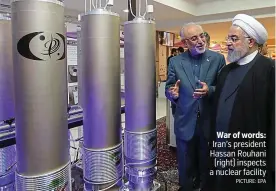  ?? PICTURE: EPA ?? War of words: Iran’s president Hassan Rouhani (right) inspects a nuclear facility