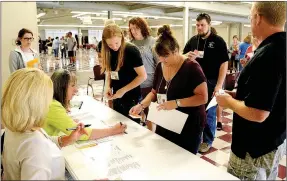  ?? Janelle Jessen/Herald-Leader ?? Payday loans were another option for quick cash during the poverty simulation­s.