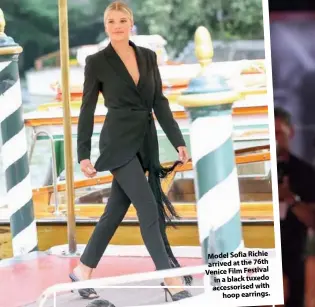  ??  ?? Model Sofia Richie arrived at the 76th Venice Film Festival in a black tuxedo accessoris­ed with hoop earrings.