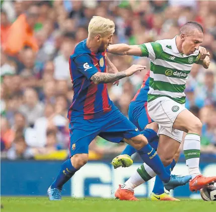  ?? Photograph: Getty ?? Scott Brown gets to grips with Lionel Messi during the Internatio­nal Champions Cup in the summer. The Spanish champions may be familiar foes, but games against them still whet the appetite