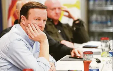  ?? Randy Hoeft / Associated Press ?? U.S. Sen. Chris Murphy, D-Conn., listens to a presentati­on during a bipartisan discussion about issues at the U.S.-Mexico border in the Yuma, Ariz., region, on Tuesday at the Regional Center for Border Health in Somerton, Ariz.