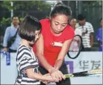  ?? PROVIDED TO CHINA DAILY ?? From left: In a series of community outreach and cultural activities in Zhuhai on the weekend, China’s Zhang Shuai shows a youngster the proper racket grip; France’s Caroline Garcia (right) and Ukrainian sibling doubles pair Lyudmyla and Nadiia Kichenok learn local cooking secrets; Aryna Sabalenka of Belarus and Estonia’s Anett Kontaveit play beach tennis and check out a seaside attraction ahead of Tuesday’s start of the year-end WTA Elite Trophy tournament.