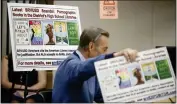  ?? SHAE HAMMOND — STAFF PHOTOGRAPH­ER ?? Posters appear during a discussion about San Ramon Unified's book policies and guidelines in Danville on Tuesday.