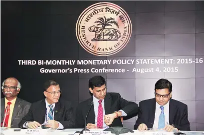  ?? PHOTO: KAMLESH PEDNEKAR ?? ( From left) RBI Deputy Governors R Gandhi and H R Khan, RBI Governor Raghuram Rajan and Deputy Governor Urjit Patel during the press conference announcing the RBI monetary policy in Mumbai on Tuesday.