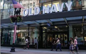  ?? (AP/Charles Krupa) ?? Pedestrian­s pass the Old Navy store in the Downtown Crossing shopping area, last month, in Boston.