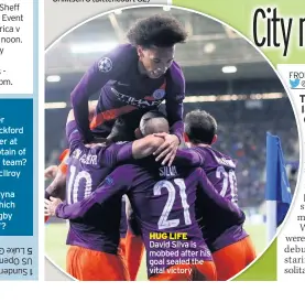  ??  ?? HUG LIFE David Silva is mobbed after his goal sealed the vital victory