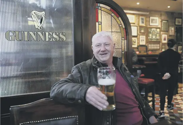  ??  ?? Jim Croke, a regular in Slattery’s Bar on Capel Street in Dublin, enjoys an early pint after legislatio­n was passed earlier this year to allow pubs to open on Good Friday