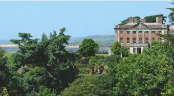  ??  ?? A magnificen­t cedar of Lebanon takes centre stage in front of the house, whose commanding position overlooks the estuary of the River Torridge