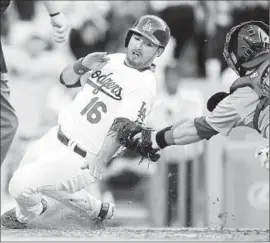  ?? Mark J. Terrill Associated Press ?? ANDRE ETHIER of the Dodgers is tagged out at home by St. Louis Cardinals catcher Tony Cruz while trying to score in the sixth inning.