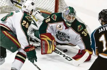  ?? Staff file photo ?? Along wiht the Aeros, Anton Khudobin, center, played for the Beaumont-based Texas Wildcatter­s, where he left a lasting impression on Wildcatter­s coach Malcolm Cameron and his family.