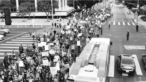  ??  ?? Supporters of the Deferred Action for Childhood Arrivals (DACA) programme march to City Hall in Los Angeles, California. — Reuters photo