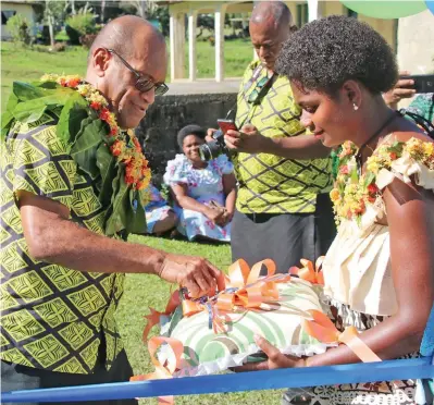  ?? Photo: DEPTFO News ?? Minister for Infrastruc­ture, Transport, Disaster Management and Meteorolog­ical Services Jone Usamate (left) at the commission­ing of the water project at Nalebaleba, Navosa on July 4, 2019.