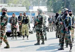  ?? — PTI ?? Army cordons off the area where militants attacked a CRPF party at Wanpoh National Highway in Kulgam district of south Kashmir on Monday