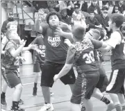  ?? Photo by Bob Parana ?? Ridgway's Charlie Close follows his shot during the Elkers 20-11 fifth-grade win over the Rams on Saturday.