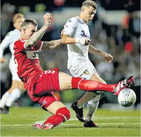  ??  ?? Tough test: Aden Flint (left) and Leeds United’s Ezgjan Alioski battle for the ball