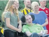  ?? Simon and Nicole with daughter Emily at a charity football game ??