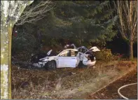  ?? THE ASSOCIATED PRESS FILE ?? This Nov. 17, 2020, photo provided by the Corvallis Police Department shows the scene where an Oregon man crashed a Tesla while going about 100 mph, destroying the vehicle and a power pole and starting a fire when some of the hundreds of batteries from the vehicle broke windows and landed in residences in Corvallis, Ore. Dylan Milota, who survived the crash, was driving the 2019 Tesla S when he lost control.