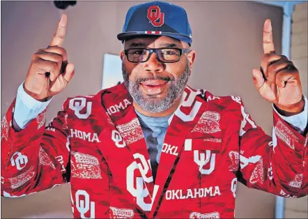  ?? [CHRIS LANDSBERGE­R/THE OKLAHOMAN] ?? Dwayne Doolittle, father of Oklahoma basketball player Kristian Doolittle, wears a flashy sports coat at Sooner games so his son's teammates can have a familiar face in the stands.