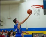  ?? AIMEE BIELOZER — FOR THE MORNING JOURNAL ?? Open Door’s Gavin Dobbins scores on a layup, part of a 34-point night to lead the Patriots to a 68-44 Division IV sectional semifinal win.