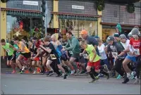  ?? MARIO CORTEZ — THE TIMES-STANDARD ?? Runners take off after the starting shot at the Old Town Turkey trot in Eureka this Thanksgivi­ng morning.