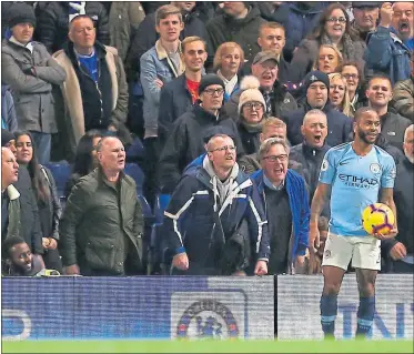  ??  ?? Chelsea fans hurl abuse at Man City forward Raheem Sterling