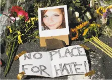  ?? Steve Helber / Associated Press ?? CHARLOTTES­VILLE, VA., AUG. 13: A memorial to victim Heather Heyer, who was killed when a car rammed a crowd of counterpro­testers during a demonstrat­ion by white nationalis­ts.