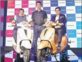  ?? RAMESH PATHANIA/MINT ?? (From left) Union minister Nitin Gadkari, Bajaj Auto MD Rajiv Bajaj and NITI Aayog CEO Amitabh Kant at the launch of electric scooter Chetak in New Delhi.