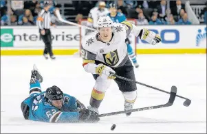  ?? AP PHOTO ?? San Jose Sharks forward Kevin Labanc, left, dives to clear the puck behind Vegas Golden Knights forward Cody Eakin during an NHL hockey game in March.