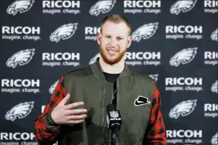  ?? MICHAEL PEREZ - THE ASSOCIATED PRESS ?? Philadelph­ia Eagles quarterbac­k Carson Wentz speaks with members of the media after an NFL game against the Dallas Cowboys, Sunday, in Philadelph­ia. The Eagles won 17-9.