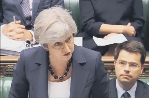  ?? PICTURE: PA WIRE ?? EXCHANGES: Theresa May speaks during Prime Minister’s Questions, where she was under scrutiny over cuts to local authoritie­s and emergency services.