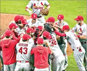  ?? GETTY IMAGES/AFP ?? The St Louis Cardinals celebrate beating the Atlanta Braves in game five of the National League Division Series at SunTrust Park on Wednesday in Atlanta, Georgia.