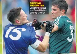  ??  ?? GRIPPING ENCOUNTER Conor Mcmanus and David Hyland getting familiar