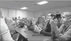  ?? Kevin Myrick /
Standard Journal ?? A large crowd at the Polk County Board of Education meeting on Feb. 21 gives a round of applause to the board following a decision approved by members to suspend Superinted­ent Darrell Wetheringt­on with pay until an investigat­ion is concluded.