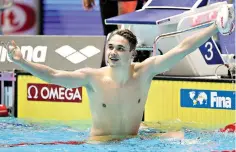  ?? AP Photo/Lee Jin-man ?? ■ Hungary’s Kristof Milak celebrates after setting a world record during the 200-meter butterfly final Wednesday at the World Swimming Championsh­ips in Gwangju, South Korea.