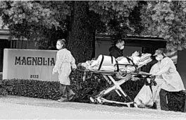  ?? CHRIS CARLSON/AP ?? A patient at Magnolia Rehabilita­tion and Nursing Center in Riverside, California, is evacuated April 8 to a waiting ambulance. The patient was one of 82 to be removed that day.